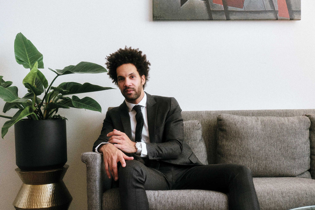 Scott Tixier wears the <a href="/collections/the-heist-timepieces/products/jbw-heist-ps-ps545b-mens-stainless-steel-diamond-watch"><u>Heist Platinum Series</u></a> in his Dallas loft.